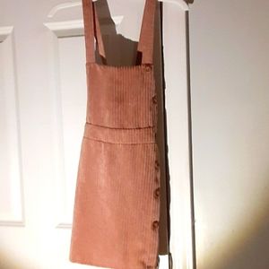 Pink strapped felt dress with buttons